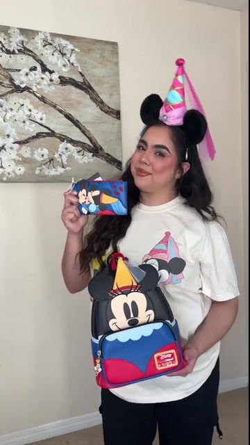 Celebrate a classic Disney romance with the Loungefly Disney Brave Little Tailor Mickey & Minnie Flap Wallet! Featuring charming artwork of Mickey and Minnie from the beloved short film, this wallet is a magical way to carry your essentials in true fairy-tale fashion.