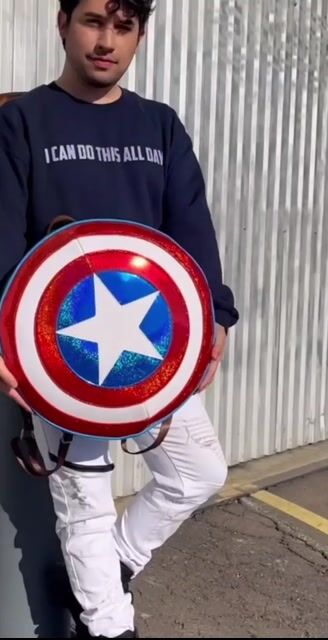 Carry your essentials with hero-worthy style using the Loungefly Marvel Captain America Shield Backpack! Designed to mimic the iconic vibranium shield, this backpack is perfect for any Marvel fan ready to take on the day with patriotic flair.